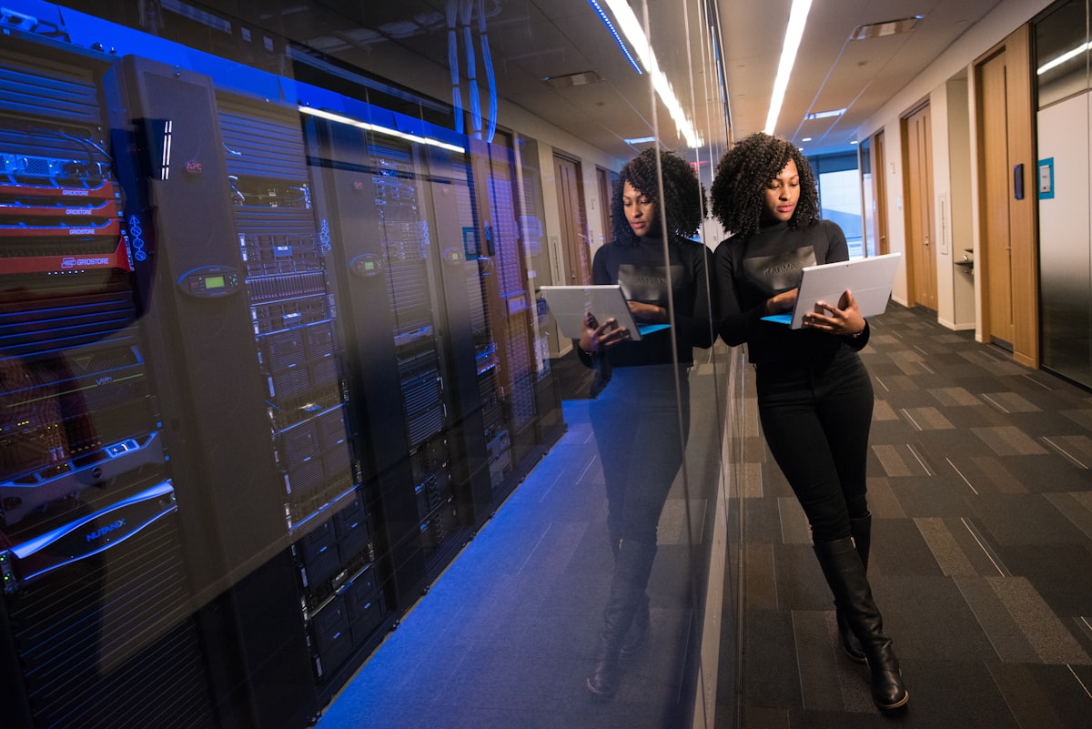Technician checking equipment in a server room